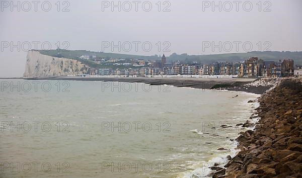 View from the coastal village of Le Treport at the mouth of the Bresle on the English Channel to Mers-les-Bains in the Somme department with the chalk cliff