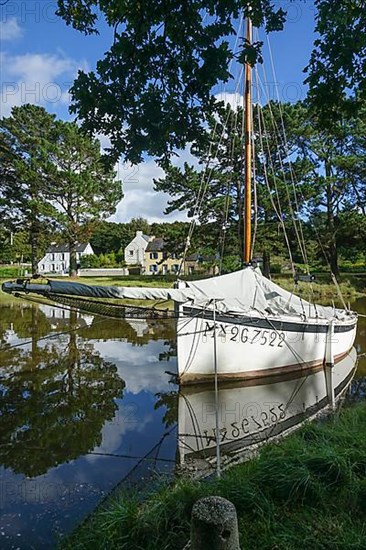 Historic sailing boat in the old harbour Pont Kalleg at the end of the inlet Anse du Moulin Neuf