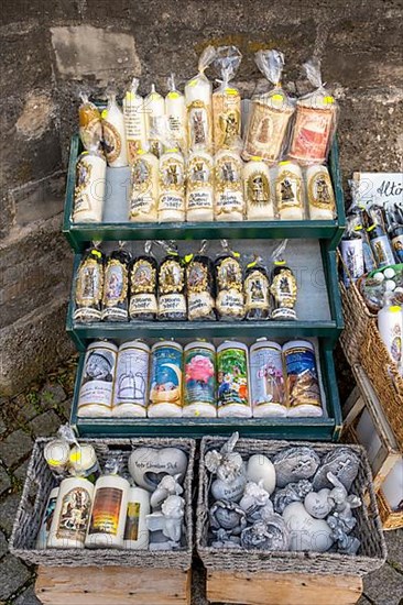 Candles in front of a devotional shop at Kapellplatz