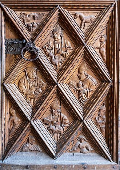 Richly decorated wooden portal of the collegiate parish church of St. Philip and St. James