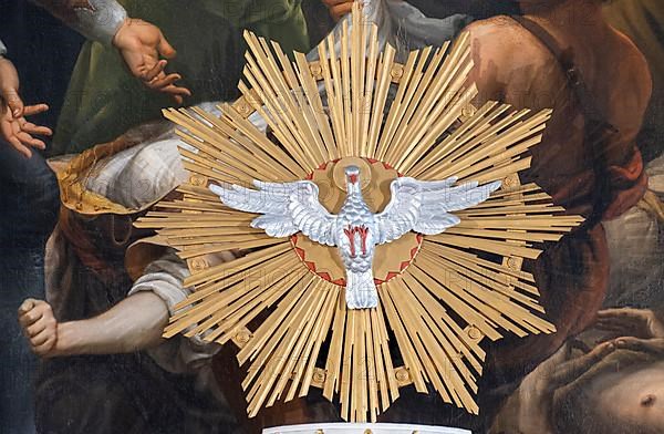 Pentecost dove in front of the altarpiece in the high altar of the collegiate parish church of St. Philip and St. James in Altoetting