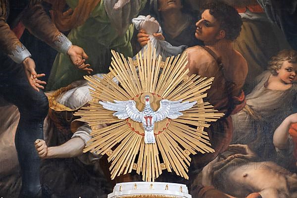 Pentecost dove in front of the altarpiece in the high altar of the collegiate parish church of St. Philip and St. James in Altoetting