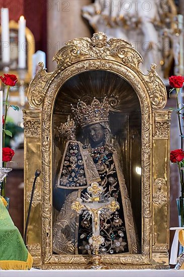 The Black Madonna in the collegiate parish church of St. Philip and St. James in the pilgrimage town of Altoetting. The image of grace is normally in the Holy Chapel