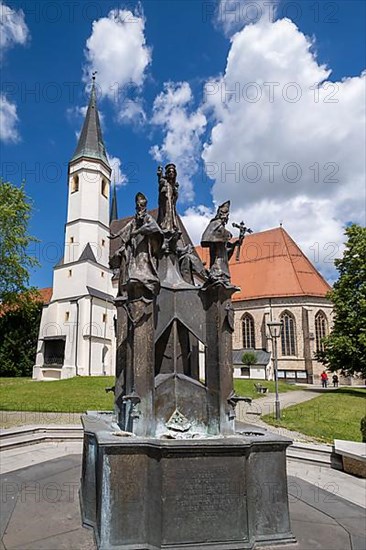 Fountain in front of the collegiate parish church of St. Philip and St. James in the pilgrimage town of Altoetting. The fountain was erected to mark the 1250th anniversary of the establishment of the four dioceses of Regensburg