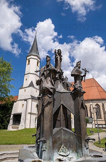 Fountain in front of the collegiate parish church of St. Philip and St. James in the pilgrimage town of Altoetting. The fountain was erected to mark the 1250th anniversary of the establishment of the four dioceses of Regensburg