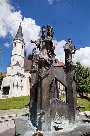 Fountain in front of the collegiate parish church of St. Philip and St. James in the pilgrimage town of Altoetting