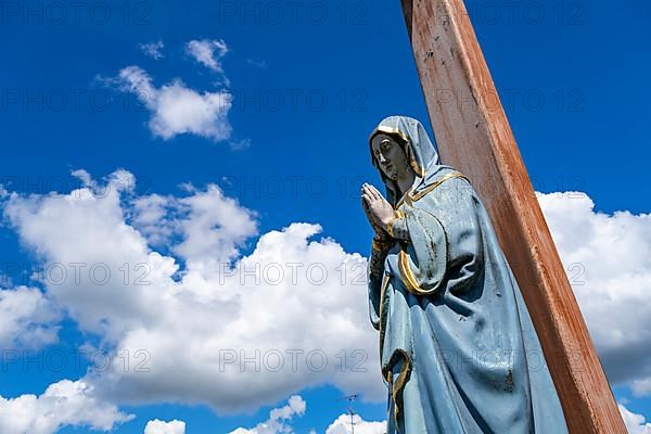 Figure of the Virgin Mary on a wooden cross in the St. Michael cemetery