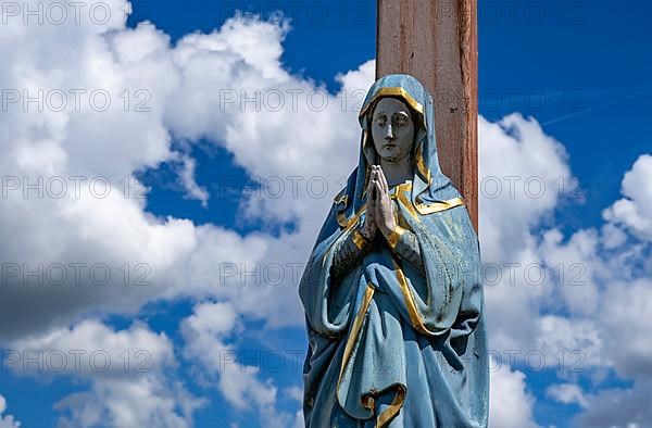 Figure of the Virgin Mary on a wooden cross in the St. Michael cemetery