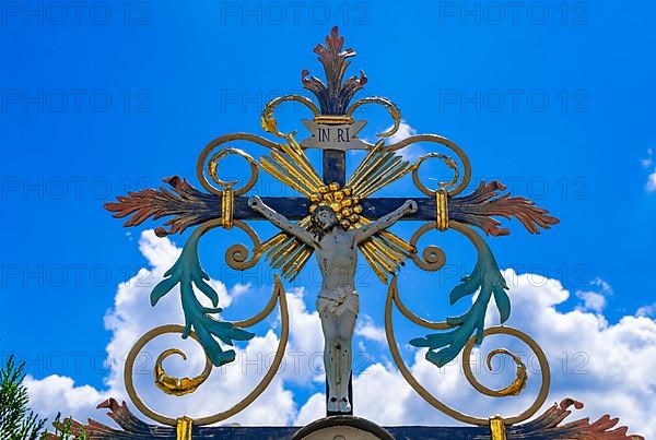 Ornate crucifix on a gravestone