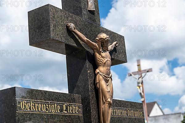 Crucifix on a gravestone at the St. Michael cemetery