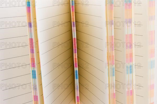 Pink notebook on a white background