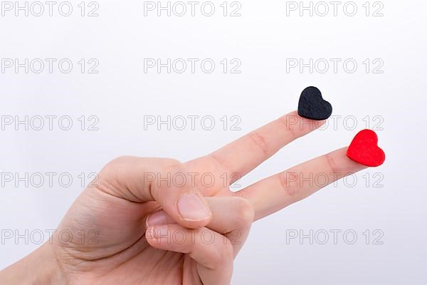 Hand with small hearts on a white background