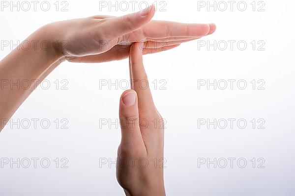 Break time hand gesture on a white background