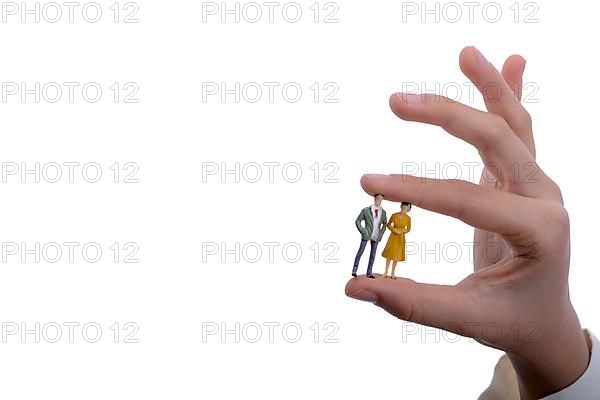 Figurine model men in hand on a white background