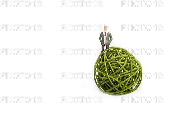 Man standing in spool of thread on a white background