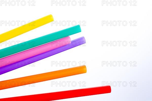 Different color of straw on a white background