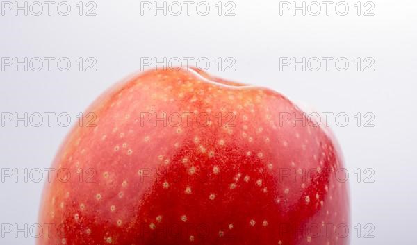 Red apple with dots in close up view