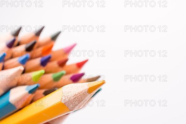 Color pencils of various colors on a white background