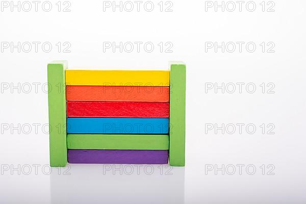 Colorful Domino Blocks in a line on a white background