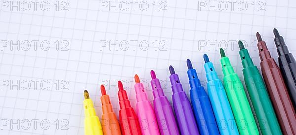 Colorful felt-tip pens on a notebook