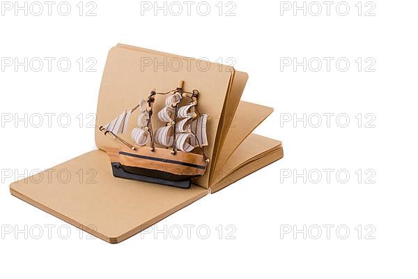 Old Ship on a notebook on a white background