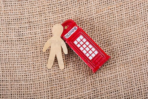 Paper man classical British style Red phone booth of London