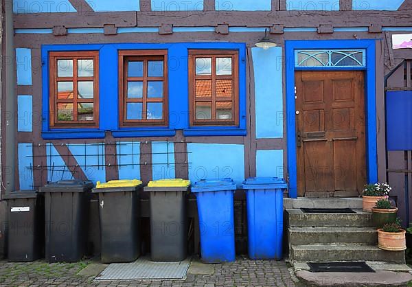 Rubbish bins in front of the house