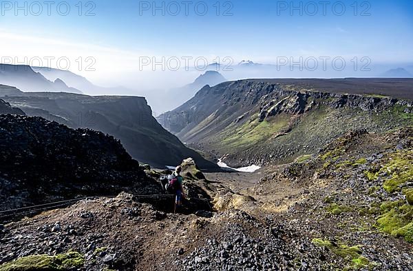 Hiker at the hiking trail Fimmvoerouhals