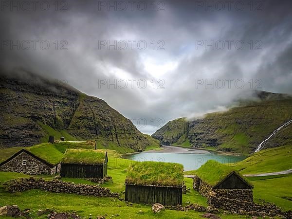 Small houses near a blue lake