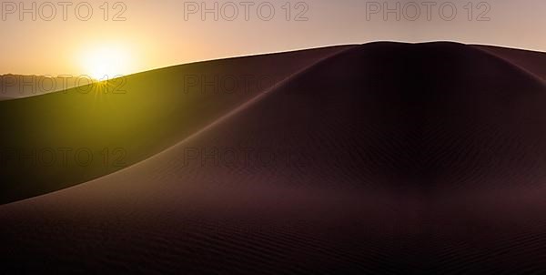 Sunset in a sandy desert