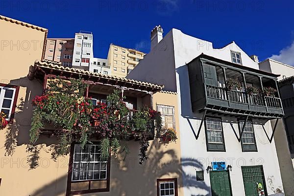 Balconies decorated with flowers on the houses of the Avenida Maritima of the city of Santa Cruz de la Palma