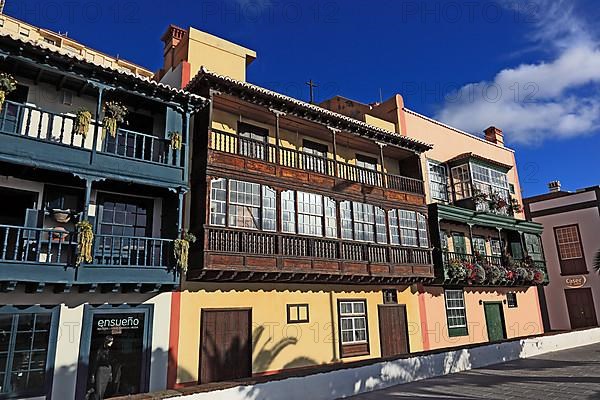 Balconies decorated with flowers on the houses of the Avenida Maritima of the city of Santa Cruz de la Palma