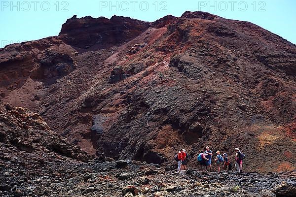 Hiking group in front of the volcano Teneguia at Cap Fuencaliente