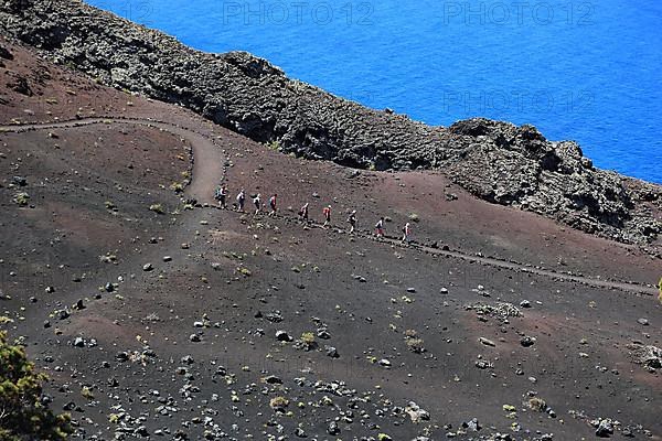 Hikers on the way from San Antonio Volcano to Teneguia Volcano at Cap Fuencaliente