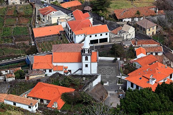 View of the village with church Porto Moniz on the northwest coast of Madeira Island