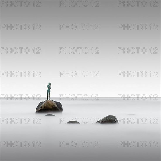 Long exposure of the statue Kaysa on the Baltic Sea beach of Ruegen
