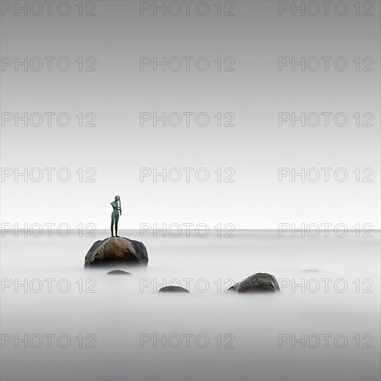 Long exposure of the statue Kaysa on the Baltic Sea beach of Ruegen