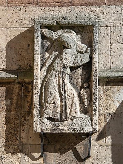 Stone relief of Christ carrying the cross on the facade of Brunswick Cathedral