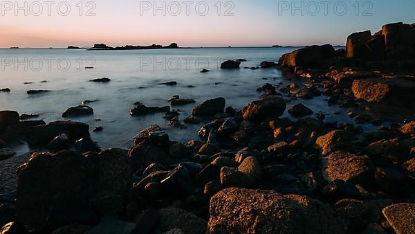 Rocks on the beach of Port Blanc in the morning light