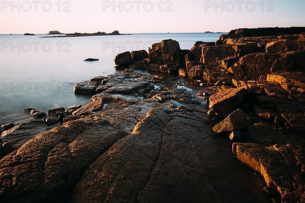 Rocks on the beach of Port Blanc in the morning light