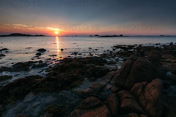 Rocks on the beach of Port Blanc in the evening light