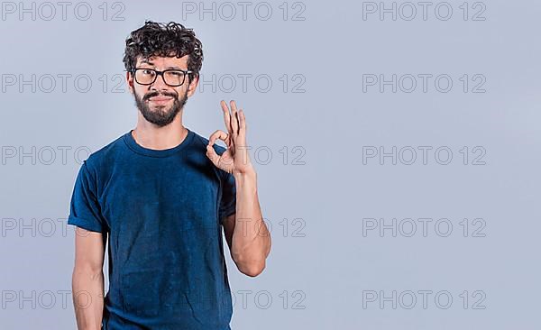 Handsome man gesturing everything is ok, Person making ok gesture