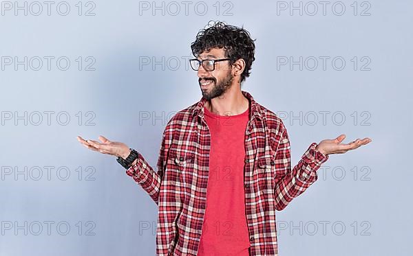 Young man balancing the palms of his hands, Person comparing with the palms of his hands