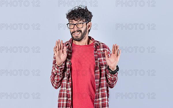 Person with denial expression moving hands. Man with denial expression, man awkwardly refusing