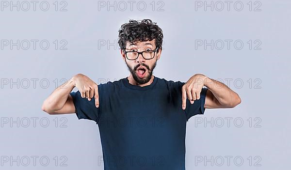 Amazed man pointing down isolated, Shocked person pointing down with fingers isolated