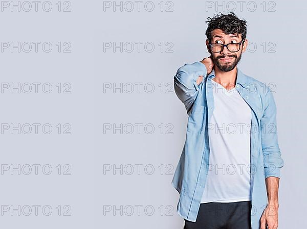 Person with uncomfortable face isolated on white background, Handsome man with uncomfortable expression isolated