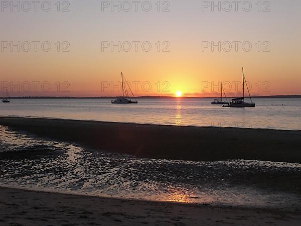 The sun sinks into the Pacific Ocean in a westerly direction, Fraser Island