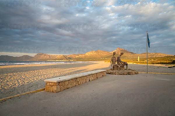 Beach promenade with sandy beach Playa Sa Canova in Son Serra de Marina, sculptures by Joan Bennassar