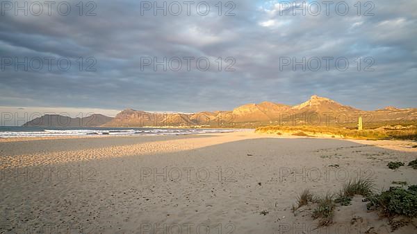 Evening atmosphere at the sandy beach Playa Sa Canova in Son Serra de Marina, in the back mountains Serres de Llevant