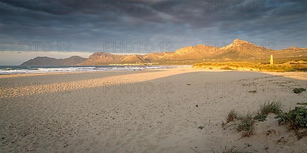 Evening atmosphere at the sandy beach Playa Sa Canova in Son Serra de Marina, in the back mountains Serres de Llevant